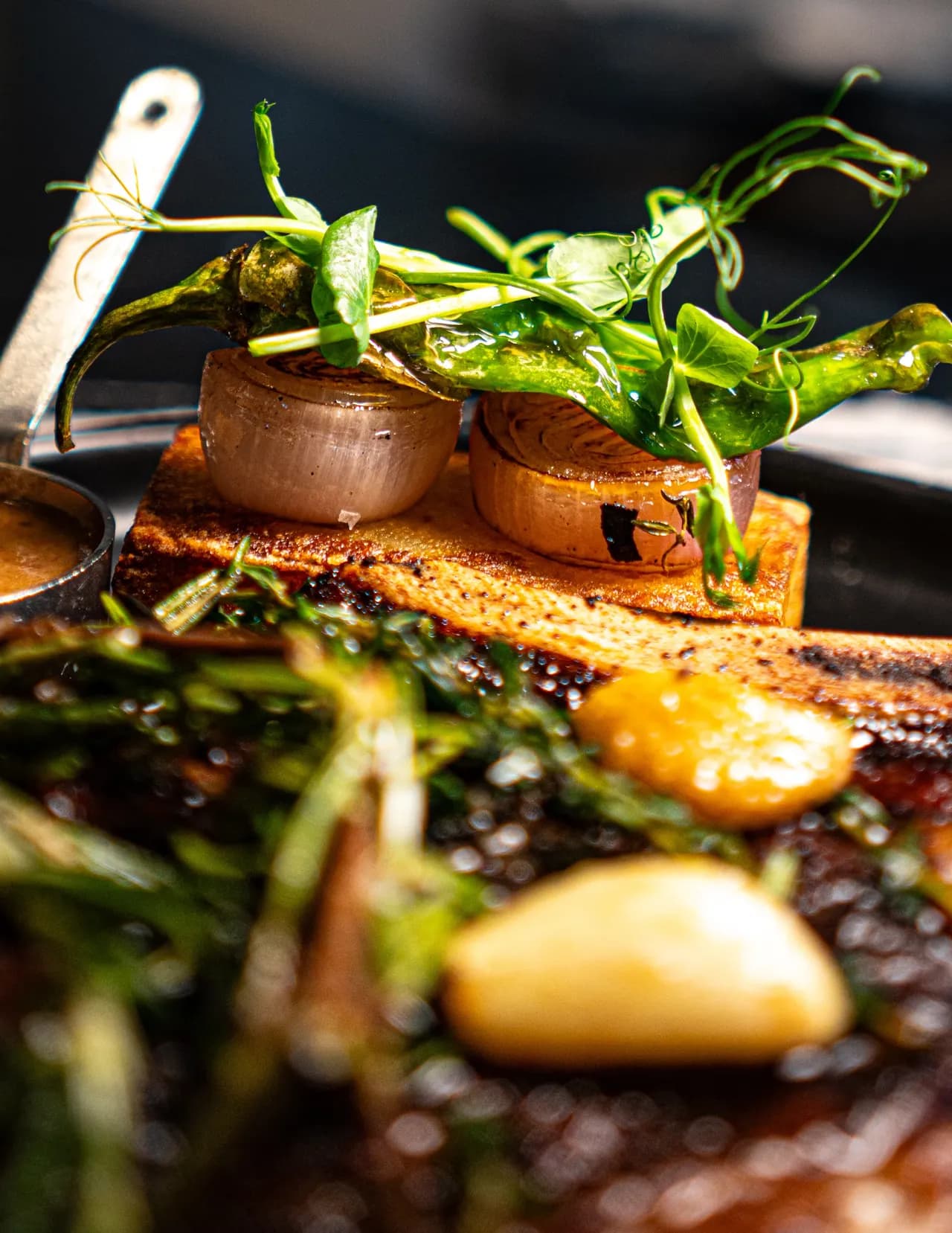Close-up of the roasted garlic and herbs on Olivia’s steak