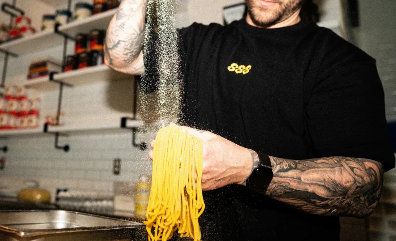 Dusting fresh pasta with flour before it goes to plate.