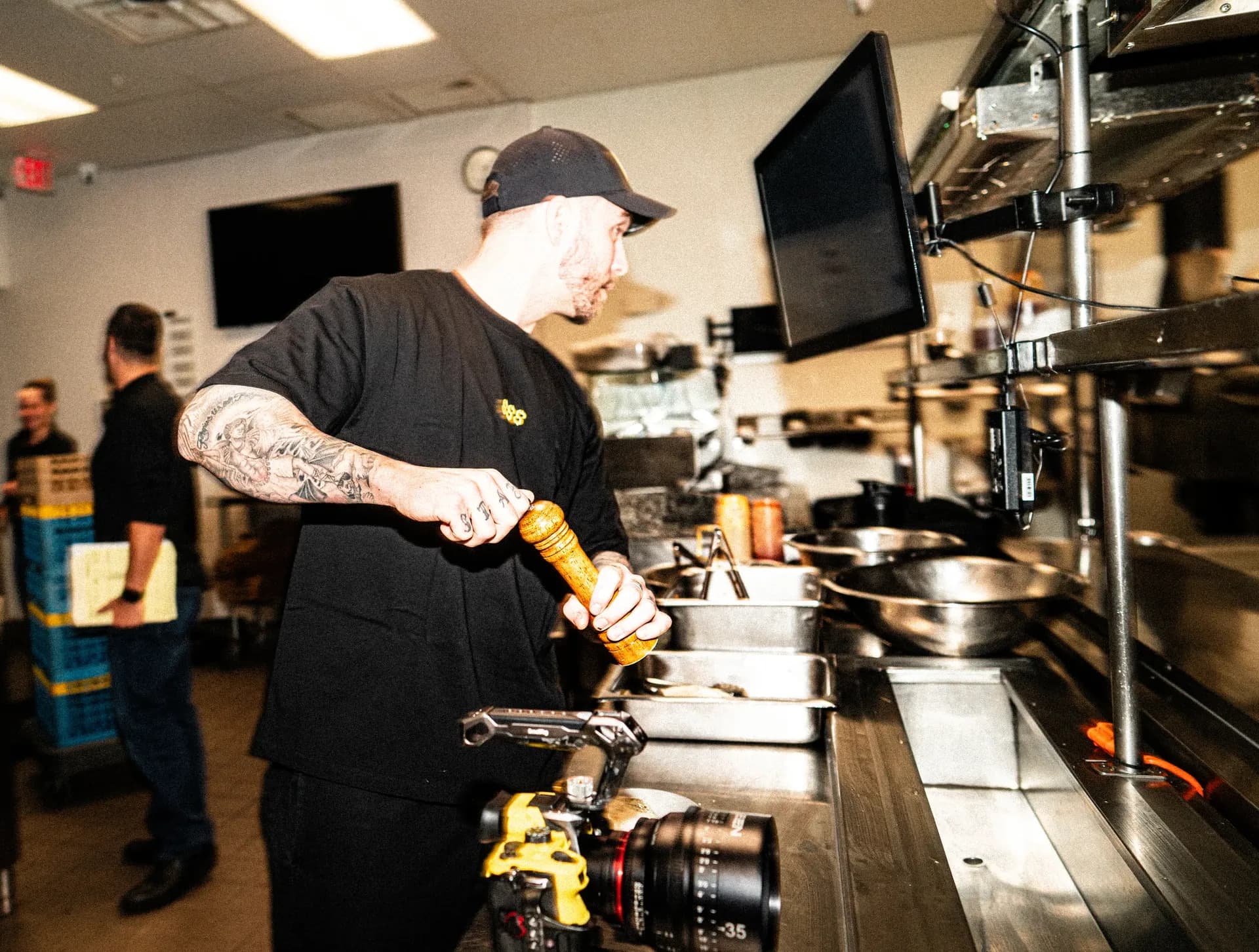 A cinema camera rig set up in a commercial kitchen during a client shoot.